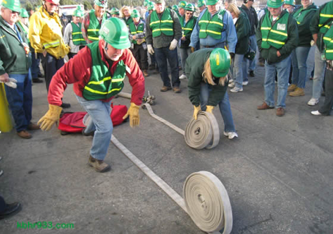 CERT volunteers unrolling fire hoses