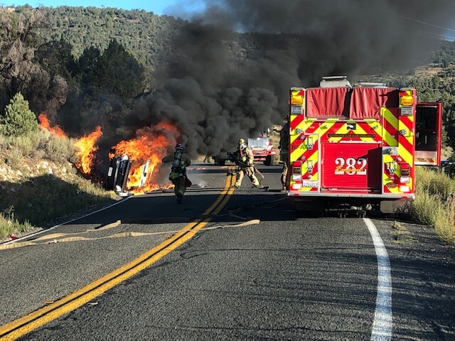 Firefighters responding to car on fire