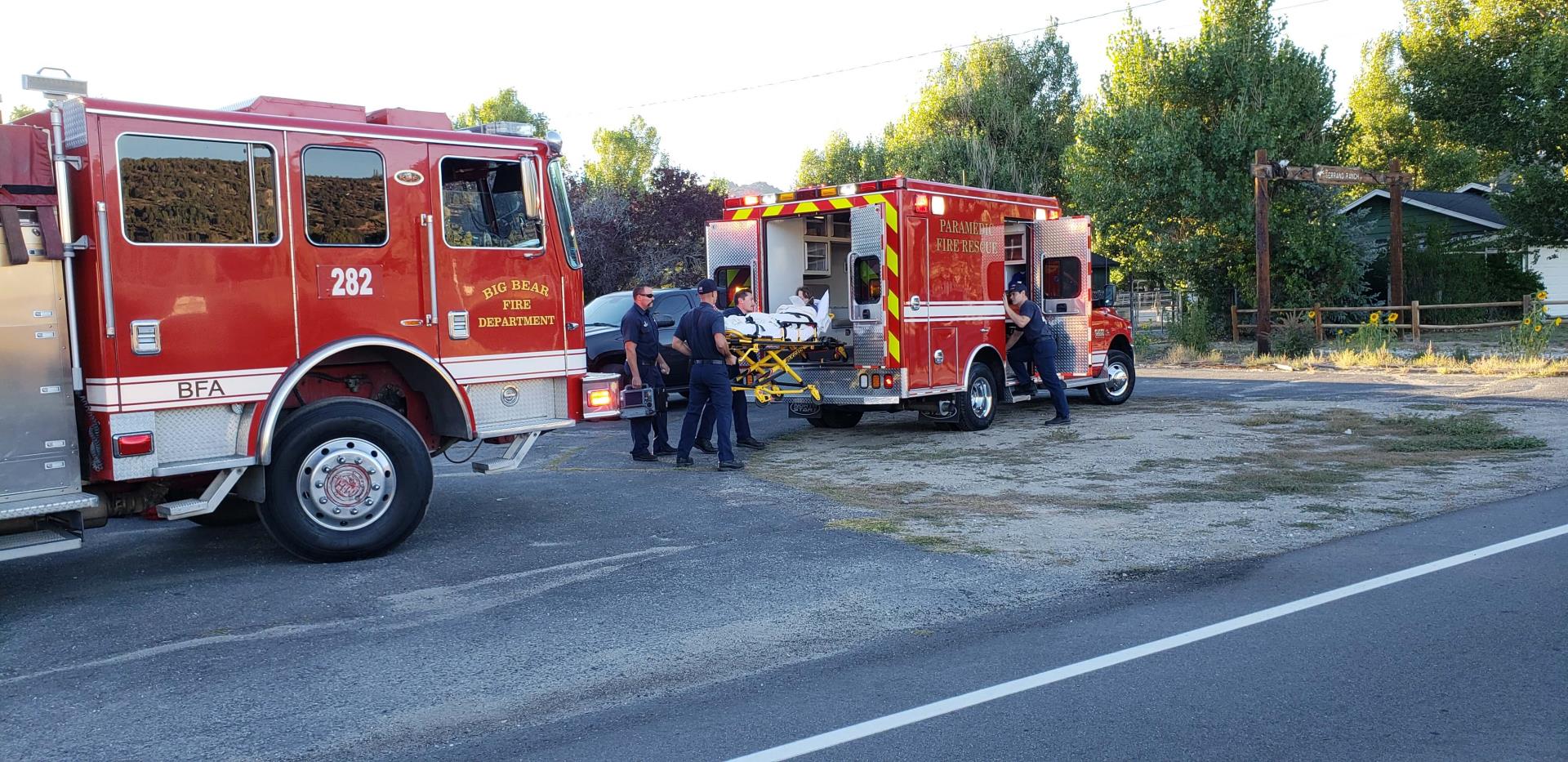 Fire truck and ambulance on the side of the road